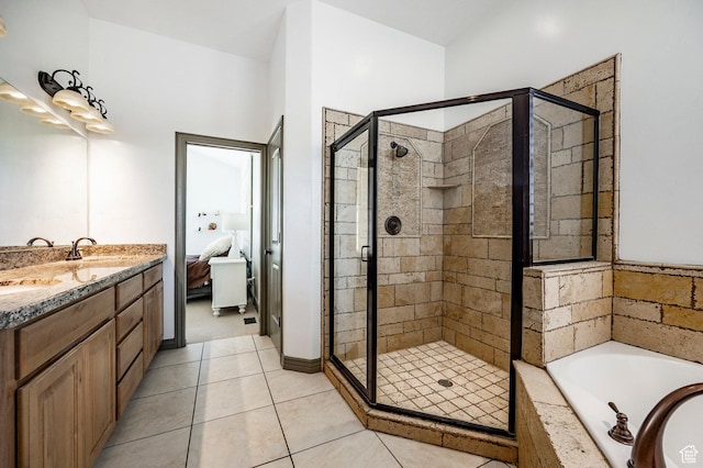 2652 E 6500 S, Uintah, UT 84403 - ensuite bathroom featuring a shower stall, a bath, tile patterned floors, and double vanity