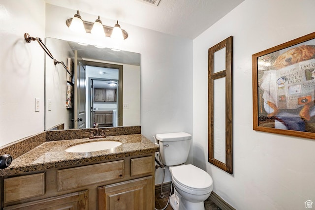2652 E 6500 S, Uintah, UT 84403 - half bath featuring toilet, vanity, and baseboards