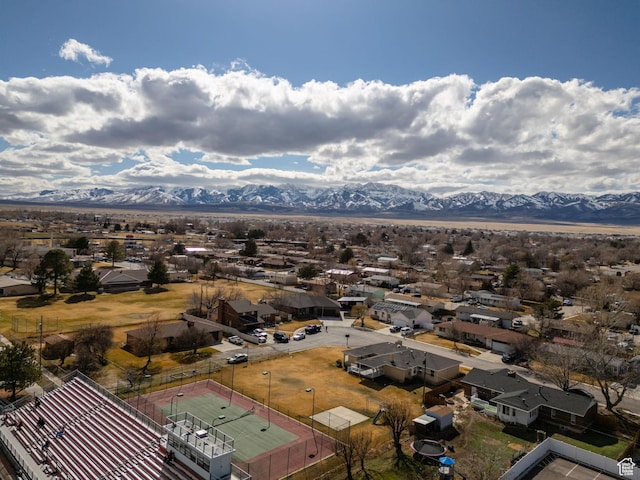 birds eye view of property with a mountain view and a residential view