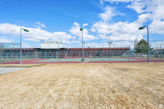 view of tennis court with fence