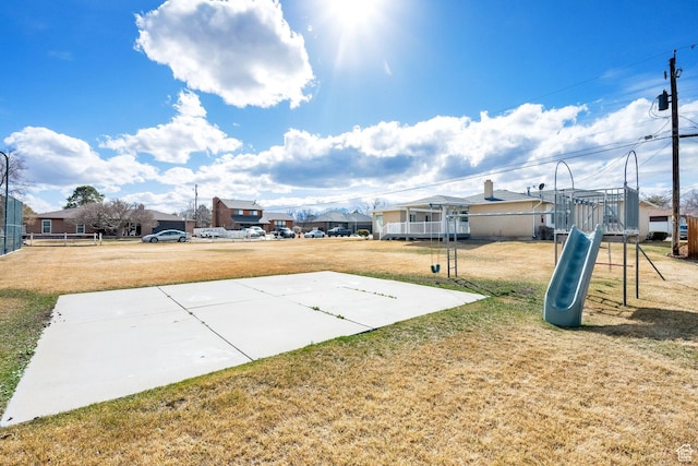 view of yard with a residential view and playground community