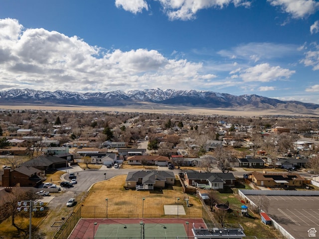 drone / aerial view featuring a residential view and a mountain view