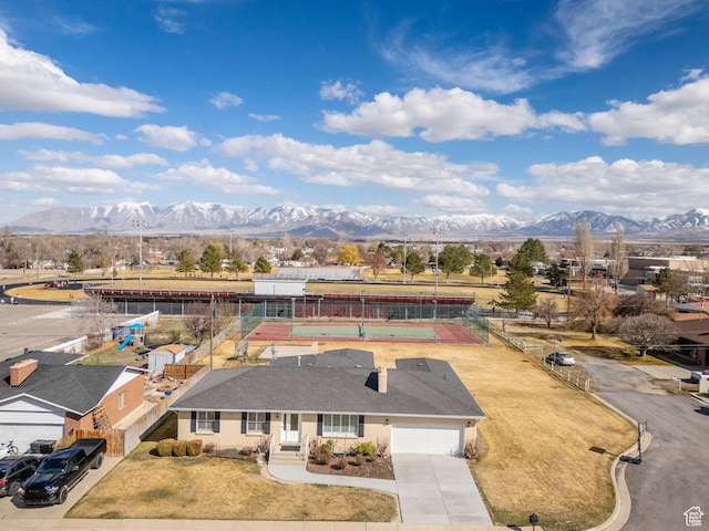 birds eye view of property with a mountain view