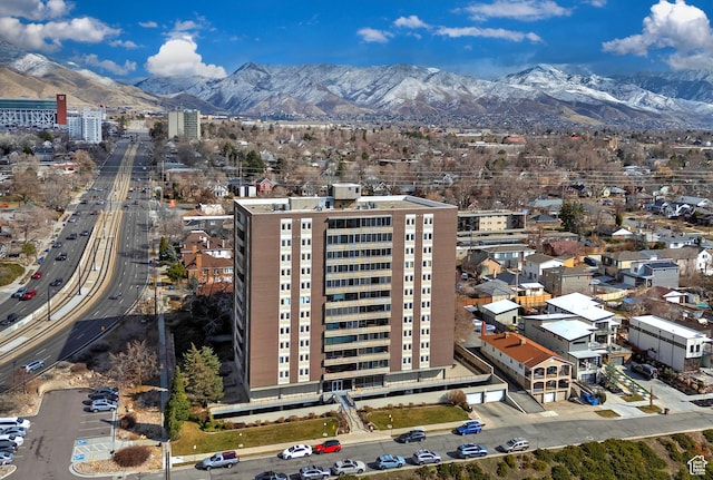 birds eye view of property featuring a mountain view and a city view