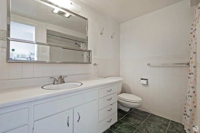 full bath featuring vanity, tile walls, curtained shower, and toilet
