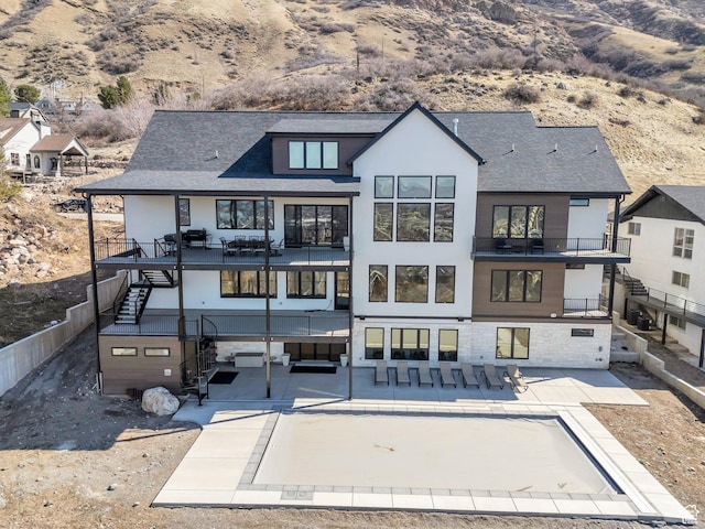 1413 N 1500 E, Provo, UT 84604 - back of property with a balcony, fence, a patio, and roof with shingles