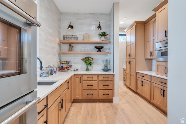 1413 N 1500 E, Provo, UT 84604 - kitchen featuring light wood-type flooring, open shelves, light countertops, stainless steel oven, and decorative backsplash