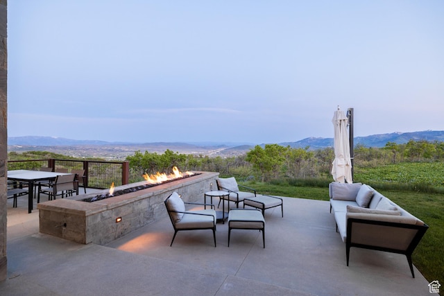 9774 N Red Hawk Trl, Park City, UT 84098 - view of patio / terrace with an outdoor living space with a fire pit and a mountain view