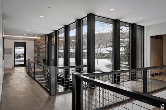 9774 N Red Hawk Trl, Park City, UT 84098 - hallway featuring recessed lighting, expansive windows, an upstairs landing, and wood finished floors