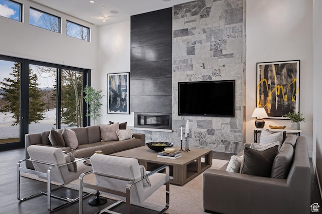 9774 N Red Hawk Trl, Park City, UT 84098 - living room featuring a towering ceiling, wood finished floors, and a high end fireplace