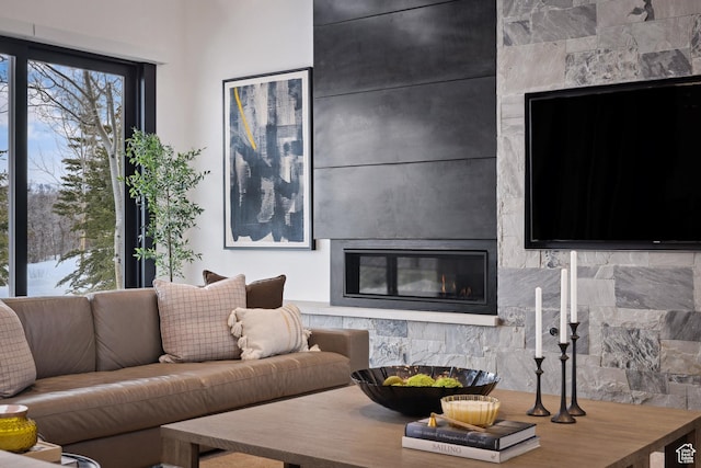 9774 N Red Hawk Trl, Park City, UT 84098 - living room featuring a glass covered fireplace
