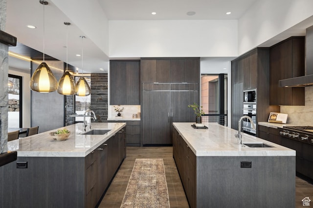9774 N Red Hawk Trl, Park City, UT 84098 - kitchen featuring modern cabinets, an island with sink, stainless steel appliances, and a sink