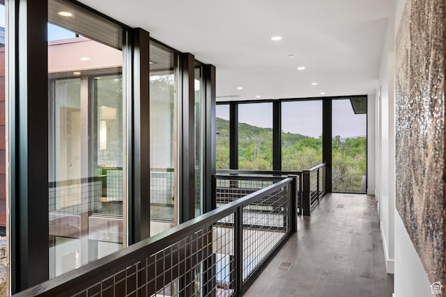 9774 N Red Hawk Trl, Park City, UT 84098 - hall with floor to ceiling windows, healthy amount of natural light, wood finished floors, and recessed lighting