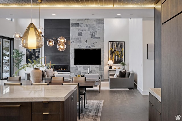 9774 N Red Hawk Trl, Park City, UT 84098 - living area featuring dark wood-type flooring, a fireplace, and baseboards