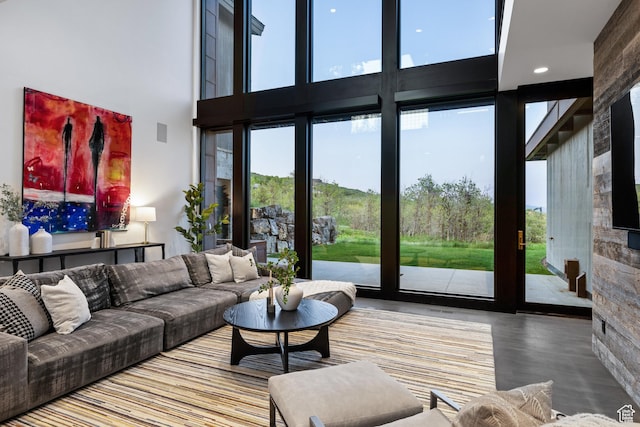9774 N Red Hawk Trl, Park City, UT 84098 - living room featuring healthy amount of natural light, a high ceiling, and wood finished floors