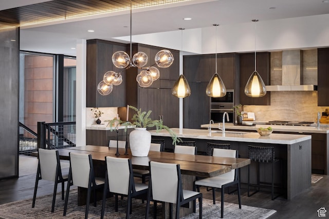 9774 N Red Hawk Trl, Park City, UT 84098 - dining room with expansive windows, dark wood-style floors, recessed lighting, stairway, and an inviting chandelier