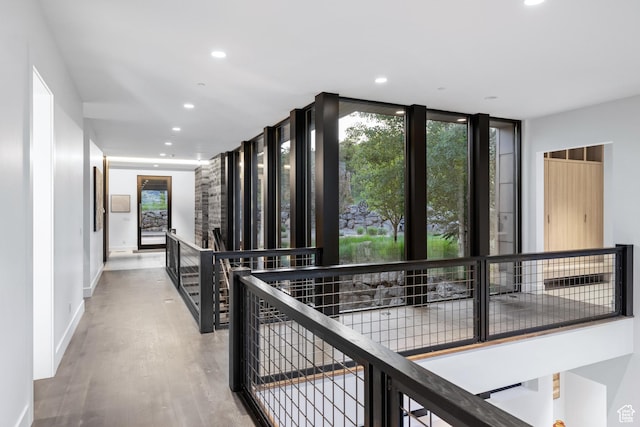 9774 N Red Hawk Trl, Park City, UT 84098 - hallway featuring an upstairs landing, recessed lighting, wood finished floors, baseboards, and expansive windows