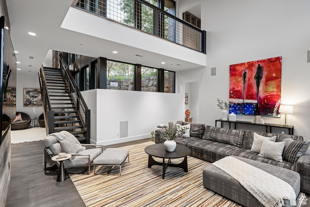 9774 N Red Hawk Trl, Park City, UT 84098 - living area featuring a towering ceiling, stairway, healthy amount of natural light, wood finished floors, and recessed lighting