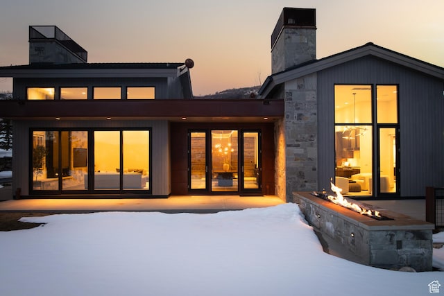 9774 N Red Hawk Trl, Park City, UT 84098 - snow covered property featuring stone siding and a chimney