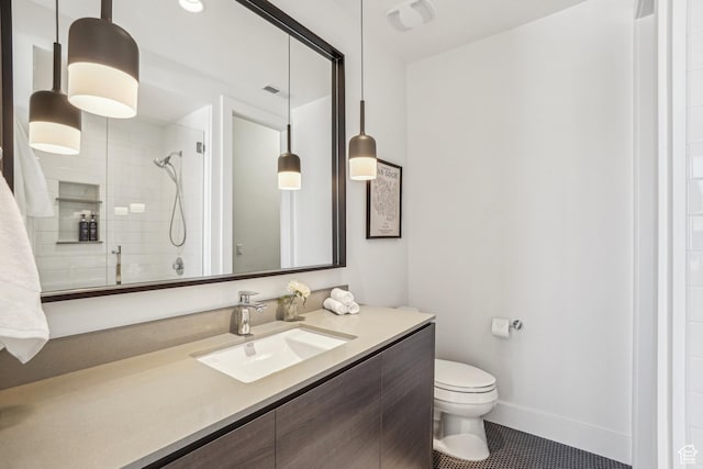 9774 N Red Hawk Trl, Park City, UT 84098 - full bathroom featuring vanity, visible vents, baseboards, a tile shower, and toilet