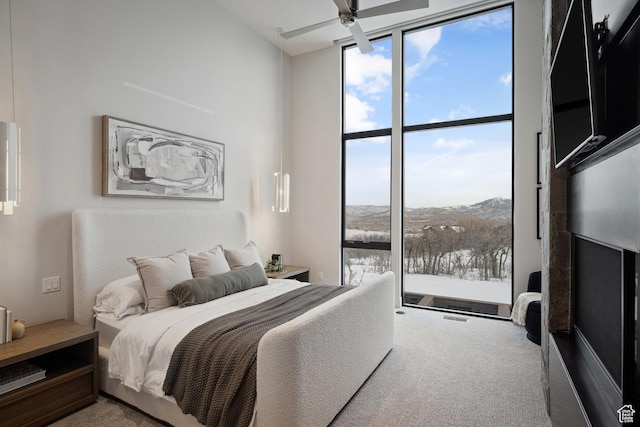 9774 N Red Hawk Trl, Park City, UT 84098 - bedroom featuring multiple windows, a wall of windows, and carpet