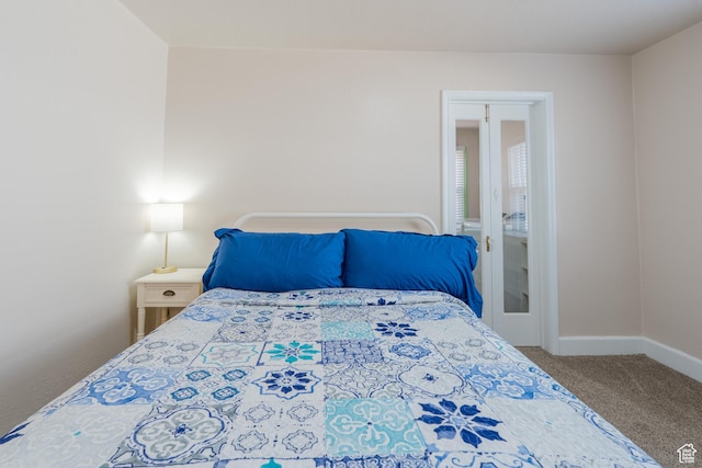 carpeted bedroom with baseboards