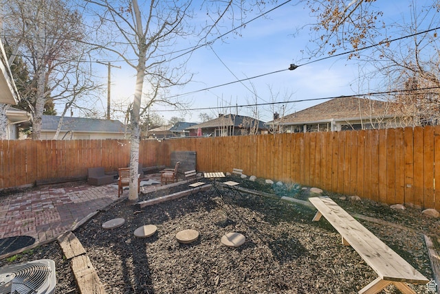view of yard featuring a patio and a fenced backyard