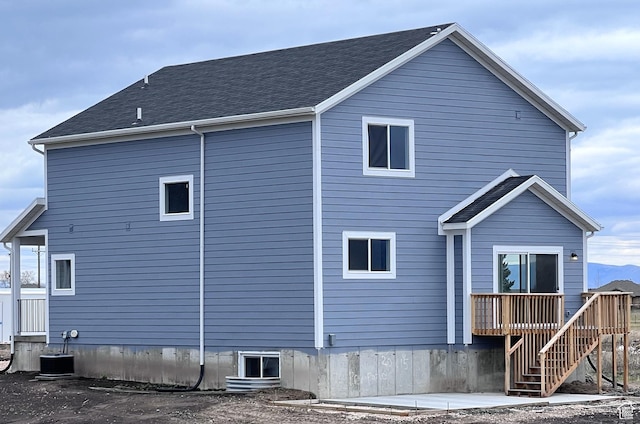 2245 S Beachcomber Ln, Garden City, UT 84028 - rear view of property featuring a wooden deck and stairs