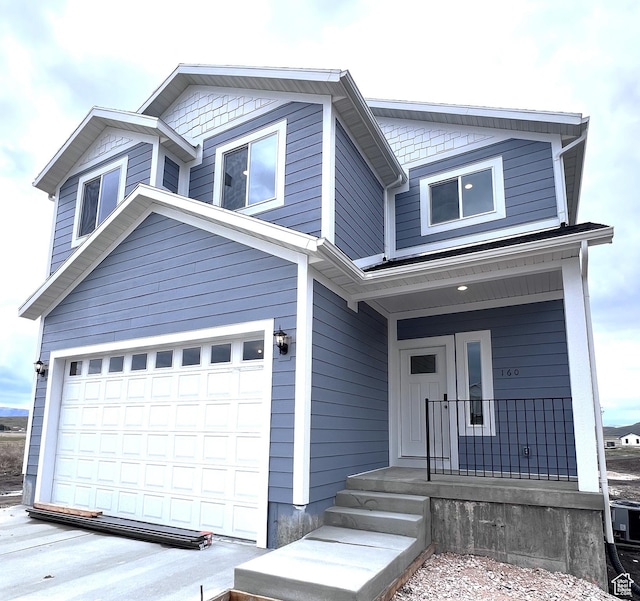 2245 S Beachcomber Ln, Garden City, UT 84028 - traditional-style house featuring a porch and an attached garage