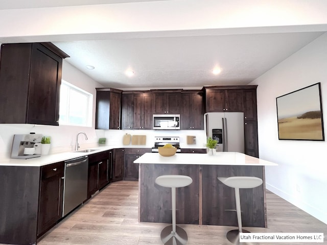 2245 S Beachcomber Ln, Garden City, UT 84028 - kitchen featuring light countertops, a center island, and stainless steel appliances
