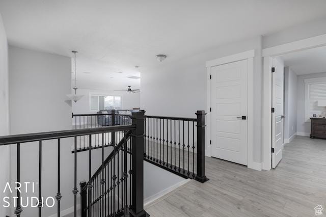 2211 W Parkview Dr, Syracuse, UT 84075 - hallway featuring an upstairs landing, light wood-type flooring, and baseboards