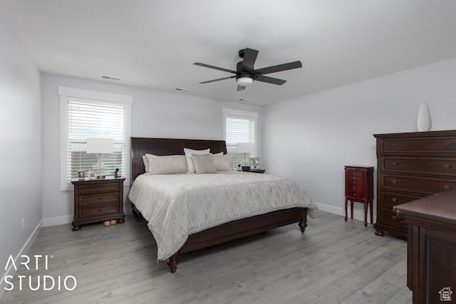 2211 W Parkview Dr, Syracuse, UT 84075 - bedroom with visible vents, a ceiling fan, light wood-type flooring, and baseboards