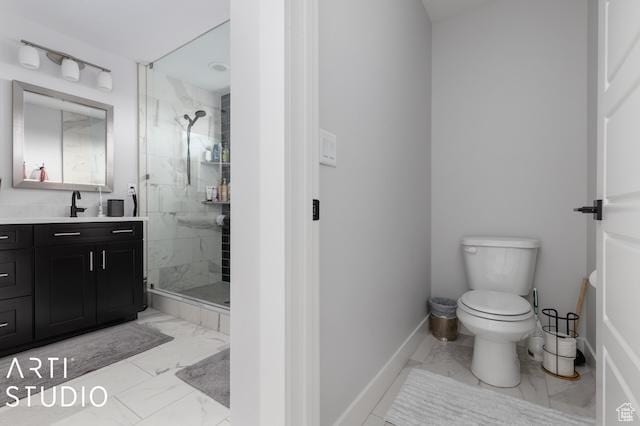 2211 W Parkview Dr, Syracuse, UT 84075 - full bath with toilet, marble finish floor, a marble finish shower, baseboards, and vanity