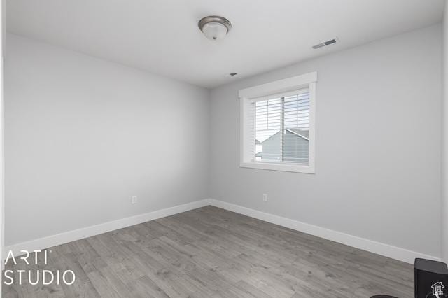 2211 W Parkview Dr, Syracuse, UT 84075 - empty room with visible vents, baseboards, and wood finished floors