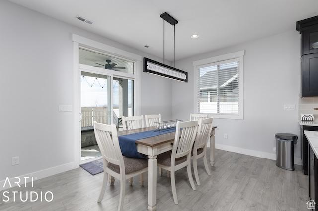 2211 W Parkview Dr, Syracuse, UT 84075 - dining space featuring visible vents, baseboards, and light wood-style floors
