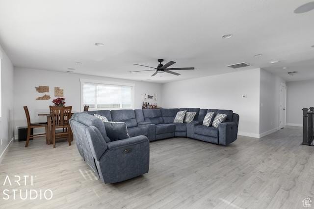 2211 W Parkview Dr, Syracuse, UT 84075 - living room with baseboards, light wood-style floors, and ceiling fan