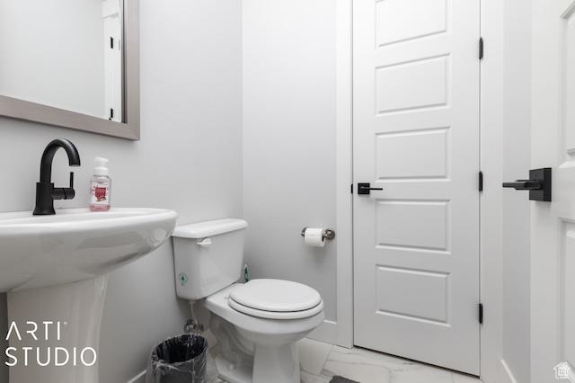 2211 W Parkview Dr, Syracuse, UT 84075 - half bath featuring marble finish floor, toilet, and baseboards