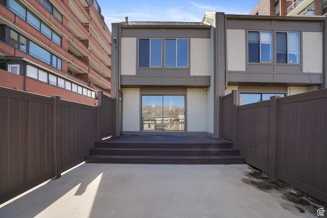 123 E 2nd Ave N Unit T-9, Salt Lake City, UT 84103 - exterior space featuring a patio, fence, and stucco siding