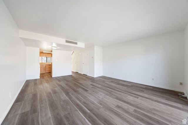 123 E 2nd Ave N Unit T-9, Salt Lake City, UT 84103 - spare room featuring visible vents, baseboards, and wood finished floors