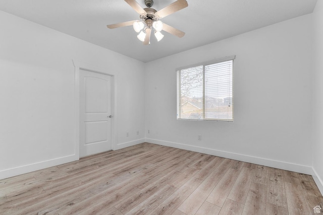 unfurnished room featuring light wood-style floors, ceiling fan, and baseboards