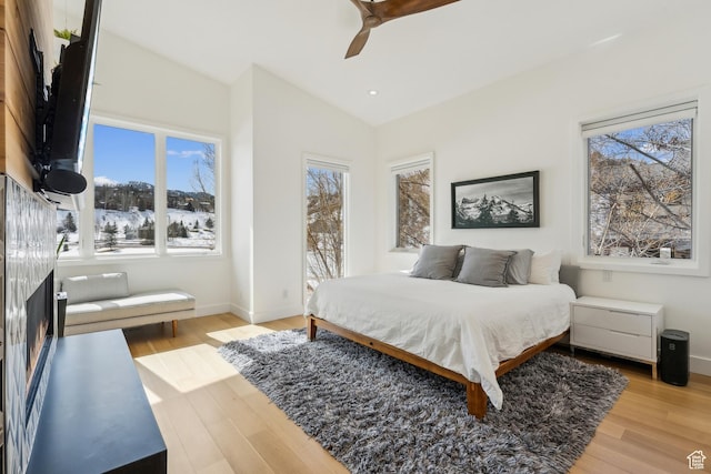 3599 Daybreaker Dr, Park City, UT 84098 - bedroom with a ceiling fan, light wood-style flooring, baseboards, and vaulted ceiling