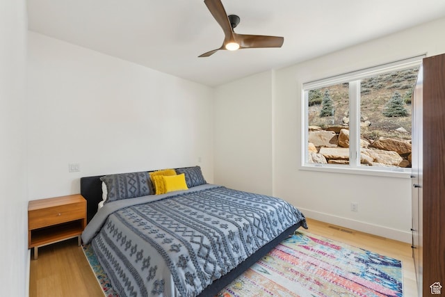 3599 Daybreaker Dr, Park City, UT 84098 - bedroom featuring a ceiling fan, visible vents, baseboards, and wood finished floors
