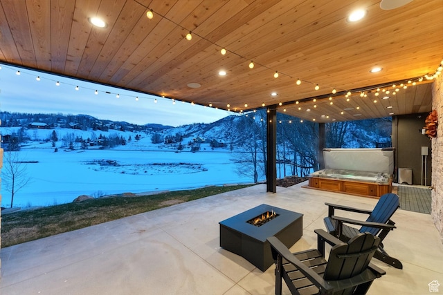 3599 Daybreaker Dr, Park City, UT 84098 - snow covered patio featuring an outdoor kitchen, a fire pit, and a mountain view