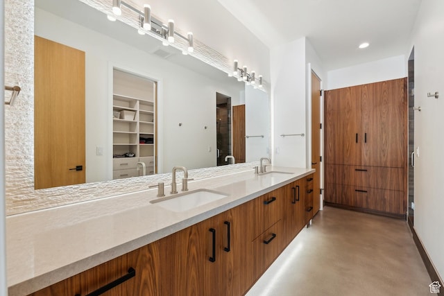 3599 Daybreaker Dr, Park City, UT 84098 - full bathroom with double vanity, a spacious closet, a sink, and concrete flooring