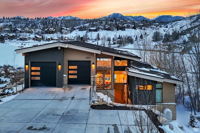 3599 Daybreaker Dr, Park City, UT 84098 - contemporary house featuring a mountain view and concrete driveway