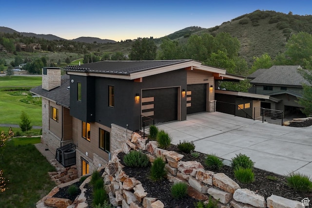 3599 Daybreaker Dr, Park City, UT 84098 - view of front of property featuring stone siding, a mountain view, and a chimney
