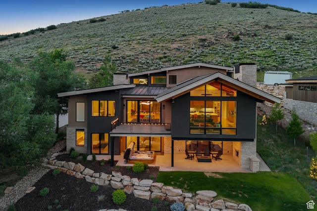 3599 Daybreaker Dr, Park City, UT 84098 - back of house with a patio area, a chimney, a standing seam roof, a yard, and a metal roof