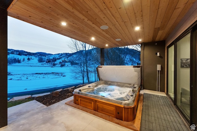 3599 Daybreaker Dr, Park City, UT 84098 - snow covered patio with a covered hot tub and a mountain view