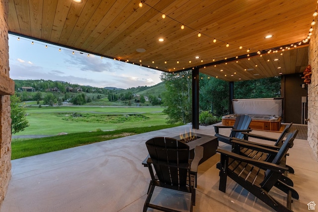 3599 Daybreaker Dr, Park City, UT 84098 - view of patio / terrace with a hot tub, a fire pit, a mountain view, and view of golf course