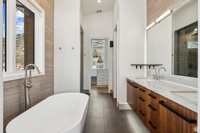 3599 Daybreaker Dr, Park City, UT 84098 - full bath with visible vents, double vanity, tile patterned floors, a sink, and a freestanding bath